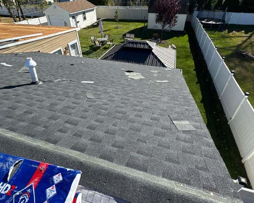 Residential roof getting repaired